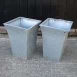 A pair of galvanised garden planters,