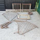 A pair of iron hay racks, together with two others, largest 128cm,