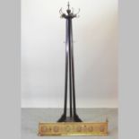 A 19th century brass fender, together with an Edwardian oak hallstand,