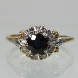 An 18 carat gold sapphire and diamond cluster ring,