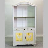 A grey painted pine cabinet bookcase, the doors decorated with chickens,