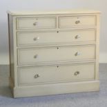 A cream painted chest of drawers,