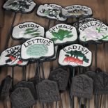 A collection of twelve cast iron vegetable signs,