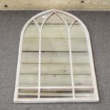 An arched outdoor mirror,