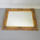 A large and ornate gilt framed wall mirror,