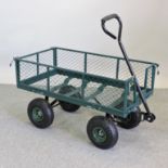 A green painted metal garden cart,