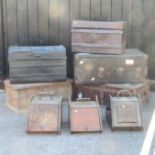 A collection of four various early 20th travelling trunks, largest 90cm, a pine box,