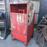 A red painted metal pump,
