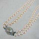 A two strand simulated pearl necklace, by Lotus,