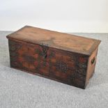 A 19th century hardwood and metal bound trunk, with studded decoration,