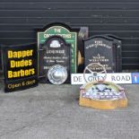 A collection of various pub and other signs,