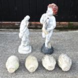 A pair of reconstituted stone acorn finials, together with a pair of pineapple finials,