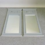 A pair of grey painted wall mirrors,