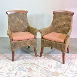 A pair of wicker conservatory chairs, together with an oriental rug,