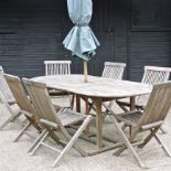 A teak extending garden table, 197 x 97cm overall,