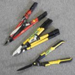 A pair of telescopic hedging shears, together with a power pruner, lopper and shear set,