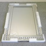 A contemporary wall mirror,