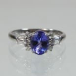 An 18 carat gold tanzanite and diamond ring, boxed,