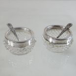 A pair of silver mounted cut glass salts,