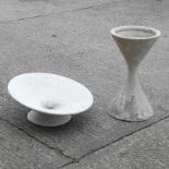 A white hourglass shaped diablo stand, 64cm high, together with a planter,