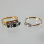 An 18 carat gold diamond and gem set ring,