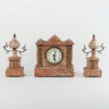 A 19th century continental rouge marble and gilt metal mounted three piece clock garniture,