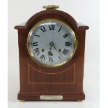 An early 20th century mahogany cased bracket clock, having a three train movement,