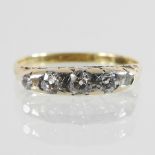 An 18 carat gold, diamond five stone ring,