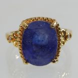 A silver gilt gem set ring,