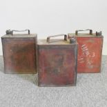 A collection of three vintage petrol cans,