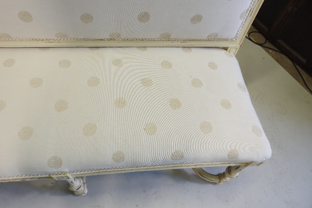 A French style cream upholstered high back sofa, on turned legs, united by shaped stretchers, - Image 9 of 9