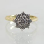 An 18 carat gold diamond cluster ring