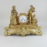 A 19th century French gilt spelter mantel clock, surmounted by two figures, striking on a bell,