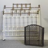 A Victorian brass and iron head board, 138cm,