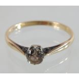 An 18 carat gold solitaire ring, the single old cut stone approx 0.