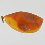 A butterscotch raw amber pendant,