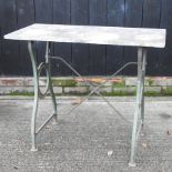 A cast iron table with a marble top,