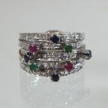 An unmarked sapphire, emerald, ruby and diamond ring,