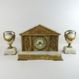 A 19th century American marble three piece clock garniture, of architectural form, with gilt mounts,