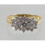 An 18 carat gold three stone diamond ring, approx 1.