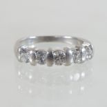 A platinum and diamond five stone half hoop eternity ring