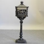 A Victorian style iron letter box,