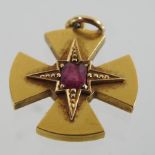 An unmarked ruby cross yellow cross