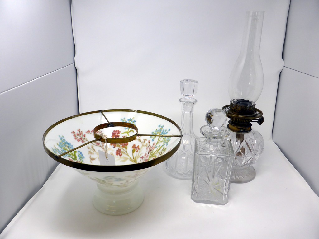 A cut glass oil lamp + milk glass floral shade, together with two cut glass decanters. (3)