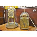 A Smiths lantern clock together with a Schatz 400 day dome clock for restoration. (2)