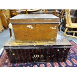 A large black initialled metal trunk with red pattern plus a small brown metal trunk (2)