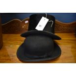 A antique top hat together with a bowler. (2)