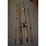 A four piece split cane fly fishing rod possibly by Alcock, cane wrapped in bands of red whipping,