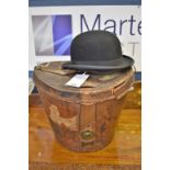 A black silk top hat by Dunn & Co in leather fitted hat box together with a collapsible top hat, &