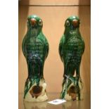 A pair of Chinese earthernware glazed green parrots (incense burners) c1860.